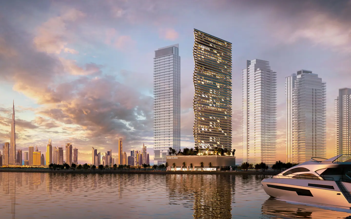 The Maritime City towers on the water, Downtown Dubai behind